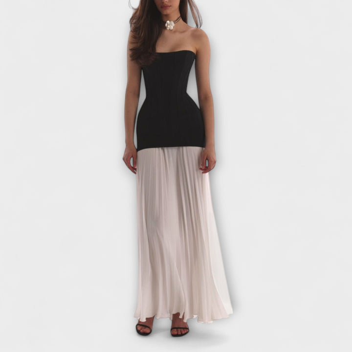Isolde - Elegant klassisk plisseret nederdel sæt" can be rewritten as:

"Isolde - Sophisticated Classic Pleated Skirt Set