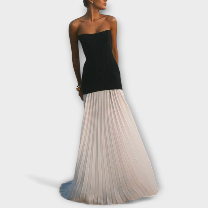 Isolde - Elegant klassisk plisseret nederdel sæt" can be rewritten as:

"Isolde - Sophisticated Classic Pleated Skirt Set