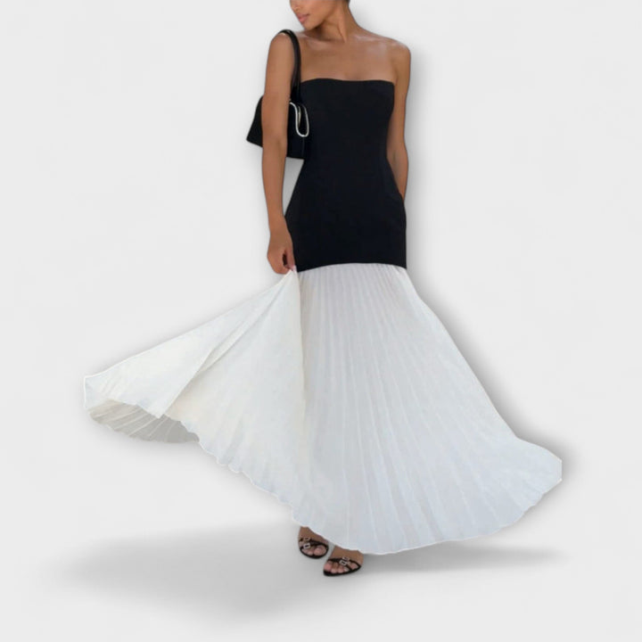 Isolde - Elegant klassisk plisseret nederdel sæt" can be rewritten as:

"Isolde - Sophisticated Classic Pleated Skirt Set