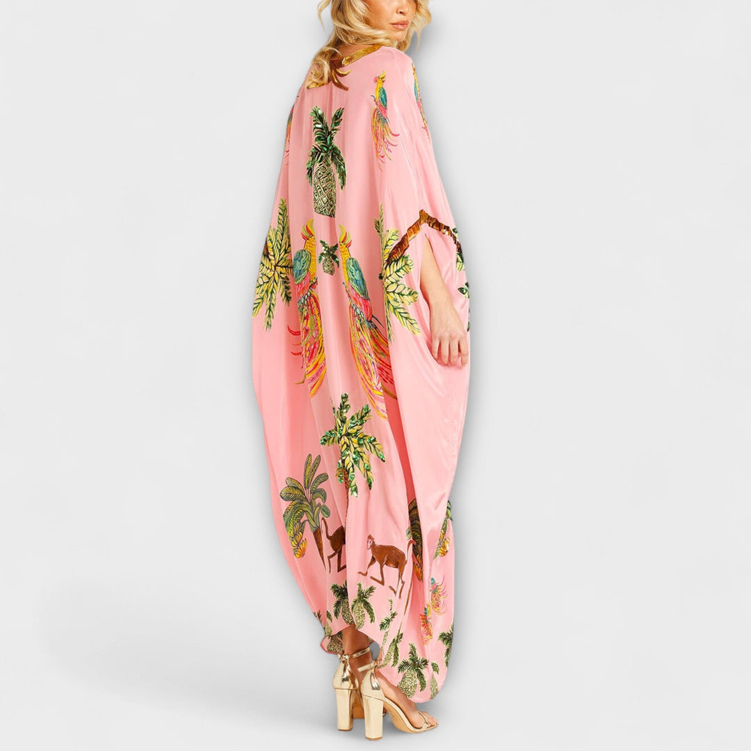 Linda - Iøjnefaldende kjole med skrå skuldre og kokosnødde-motiv