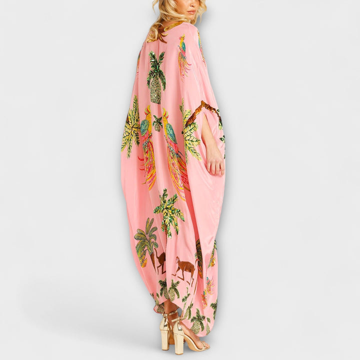 Linda - Iøjnefaldende kjole med skrå skuldre og kokosnødde-motiv